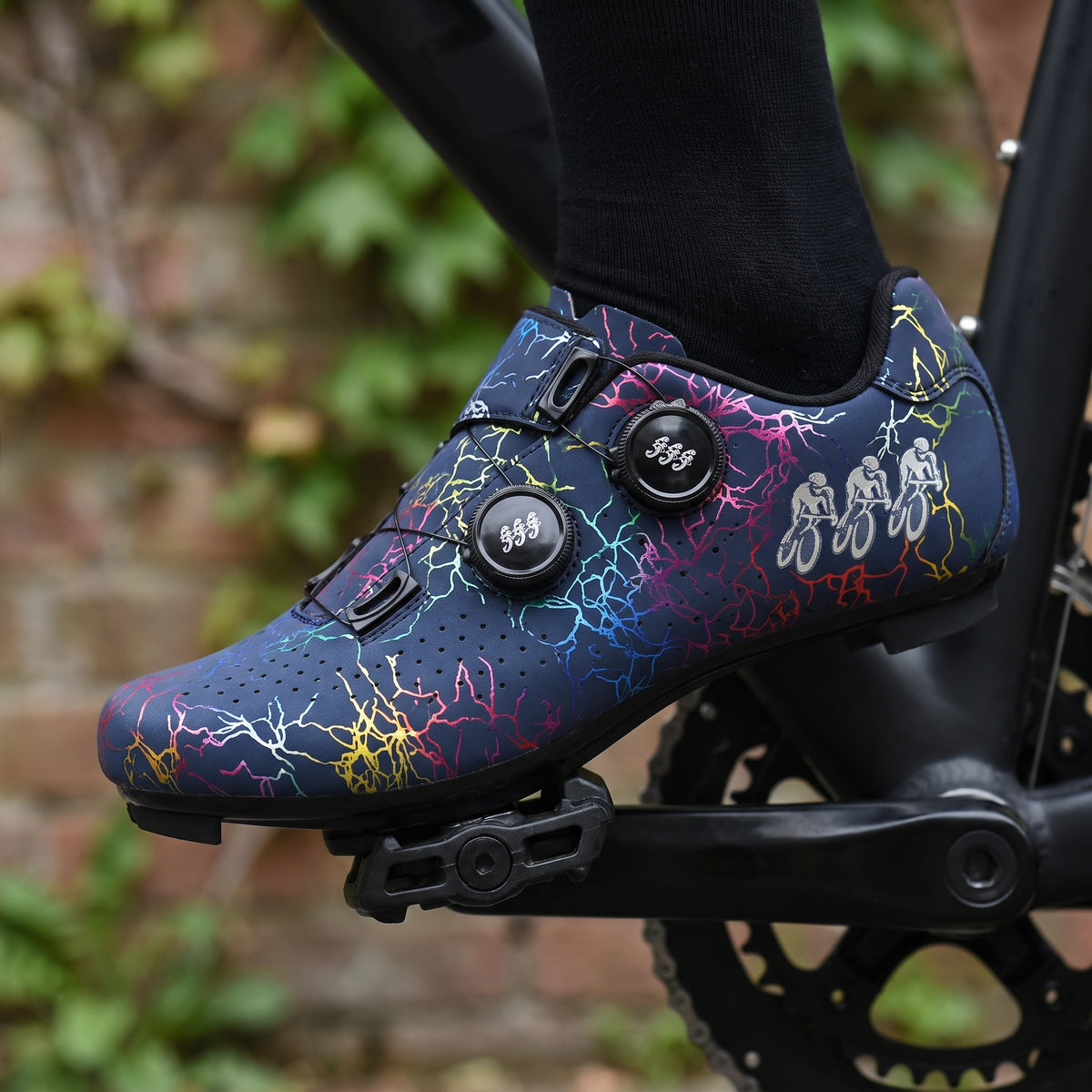 Dark Blue road cycling shoe clipped onto a clipless pedal
