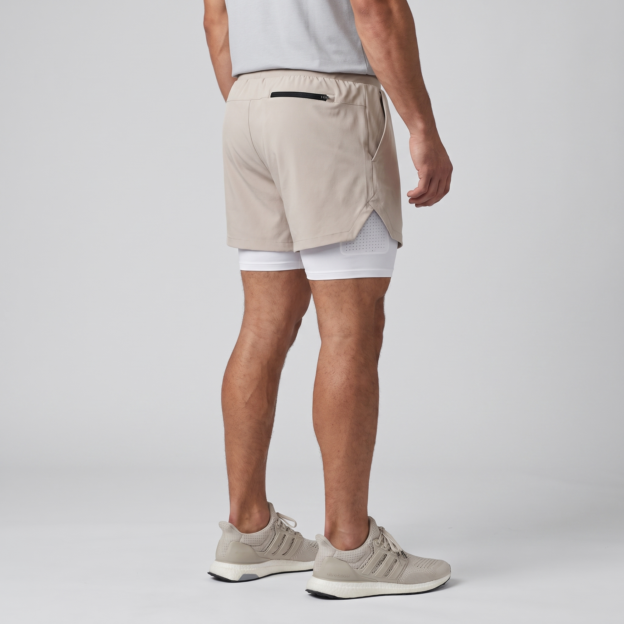 Three-quarter side view of the Khaki 2 in 1 running shorts