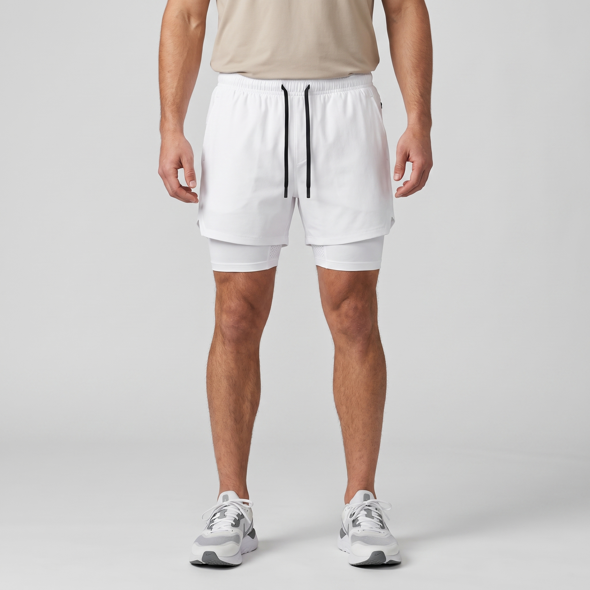 Man wearing the White 2 in 1 running shorts, front view