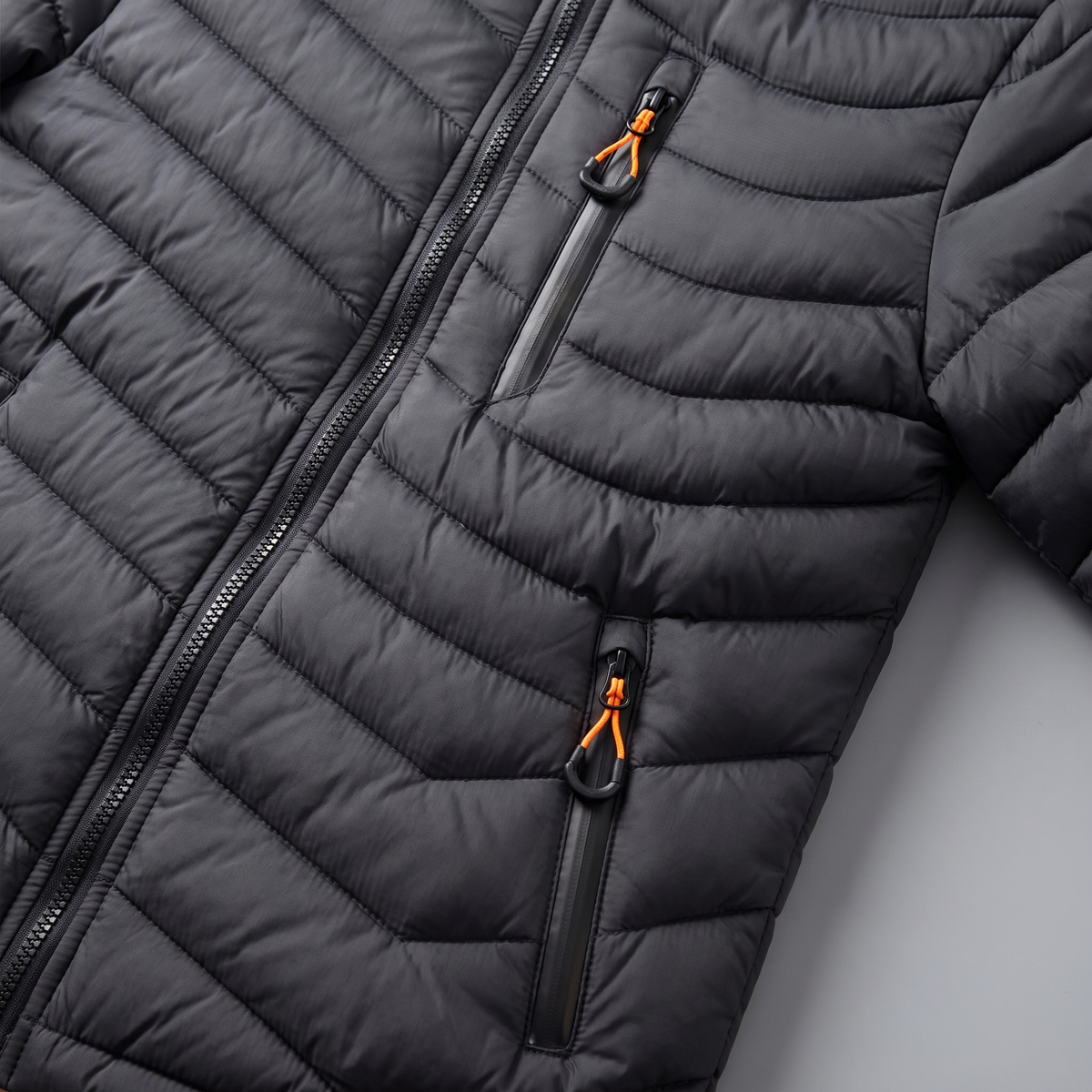 Chest zip pocket and zipped hand pocket with orange pulls