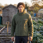 Man on an allotment in the army green windproof fleece jacket