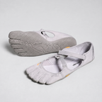 Women's barefoot five toe shoes in grey, a pair with one sole turned up