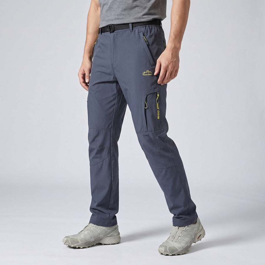 Walking in the dark grey Terrabound Hiking Trousers, side view