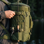 Fishing rod seated in the built-in rod holder on the side of the pack, hands free