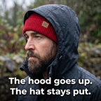 Beanie worn flat under a raised waterproof hood in the rain