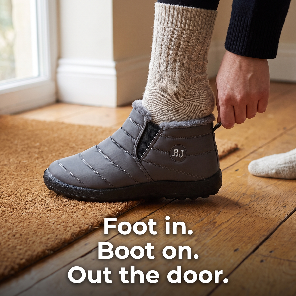 Women's slip-on snow boots: pulling the boot on by the heel tab, elastic side panel stretching