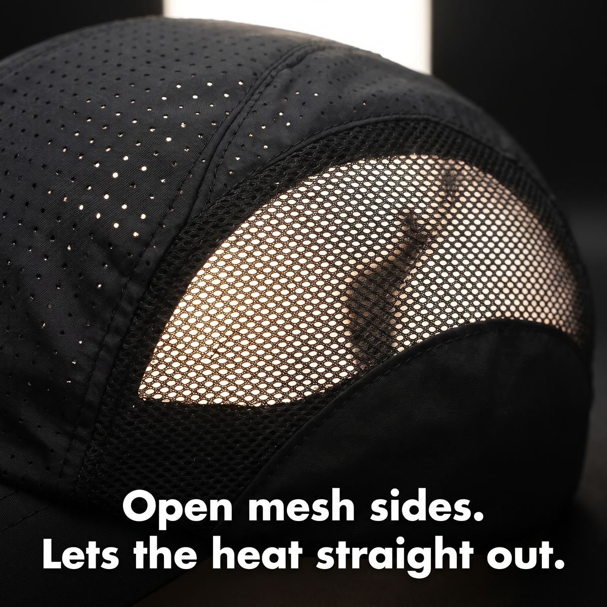 Close-up of the open mesh side panel and perforated top of the running cap