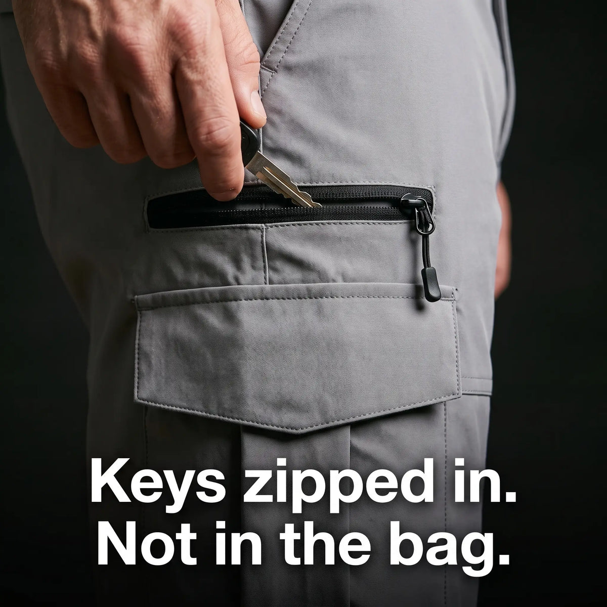 Key going into the zipped pocket above the cargo pocket