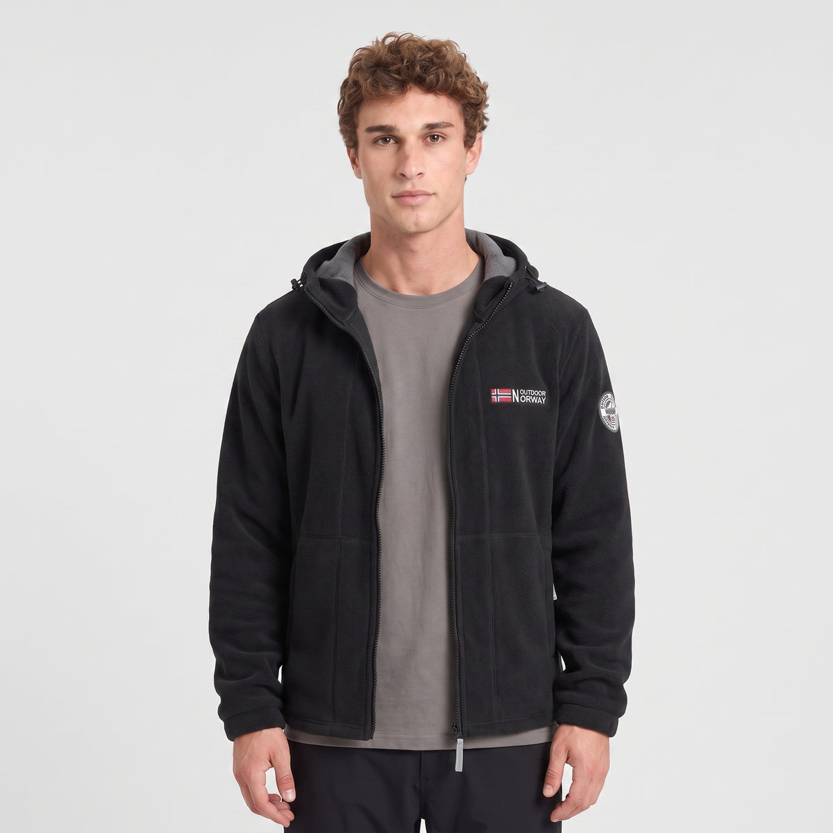 Men's black windproof fleece jacket worn, front view