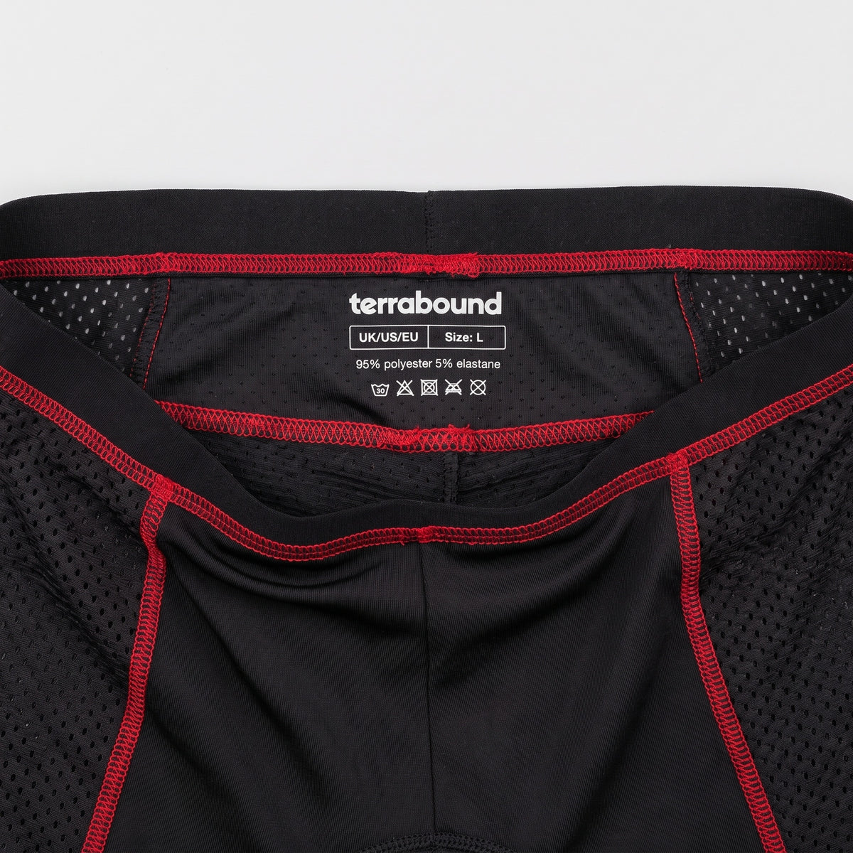 Terrabound care label printed inside the Men's Padded Cycling Undershorts, flat lay