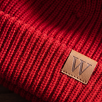 Close-up of the chunky rib knit and the stitched leather label