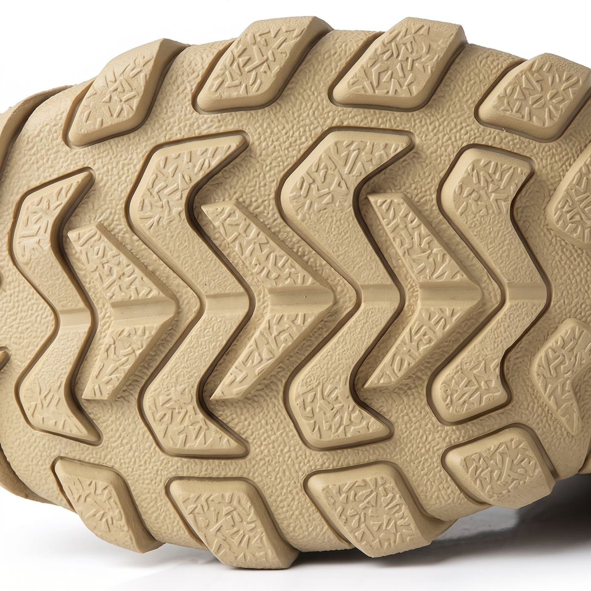 Close-up of the deep multi-directional lugged rubber outsole