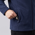 Hand closing the zipped hand pocket of the Men's Zip Up Fleece over a set of keys