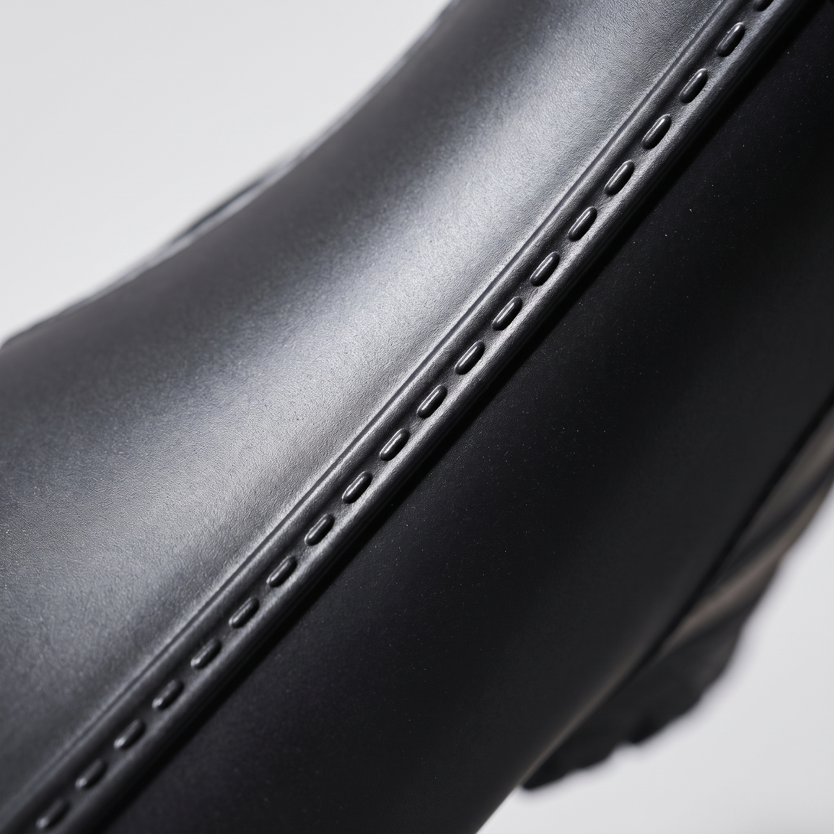 Close-up showing the stitch lines are moulded into the PVC, not sewn