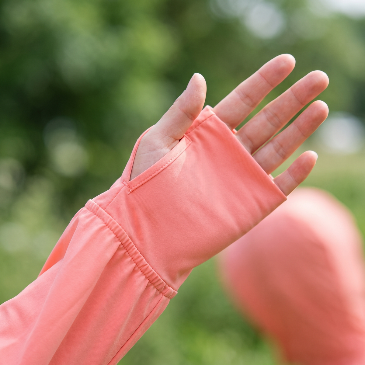 Close-up of the thumbhole cuff holding the sleeve over the back of the hand