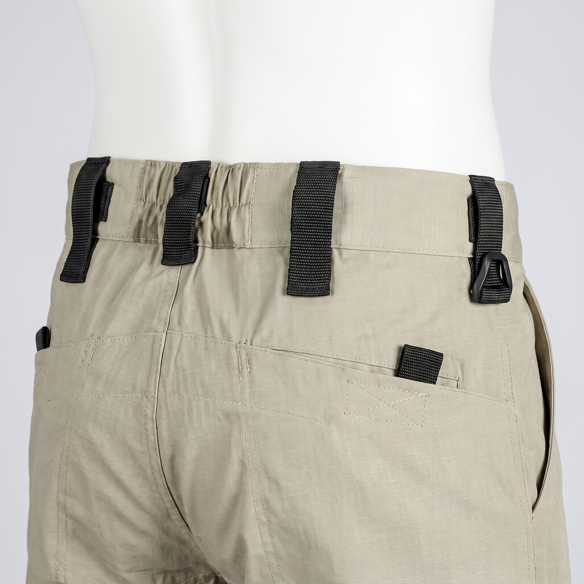 Close-up of the webbing belt loops and elasticated rear waistband