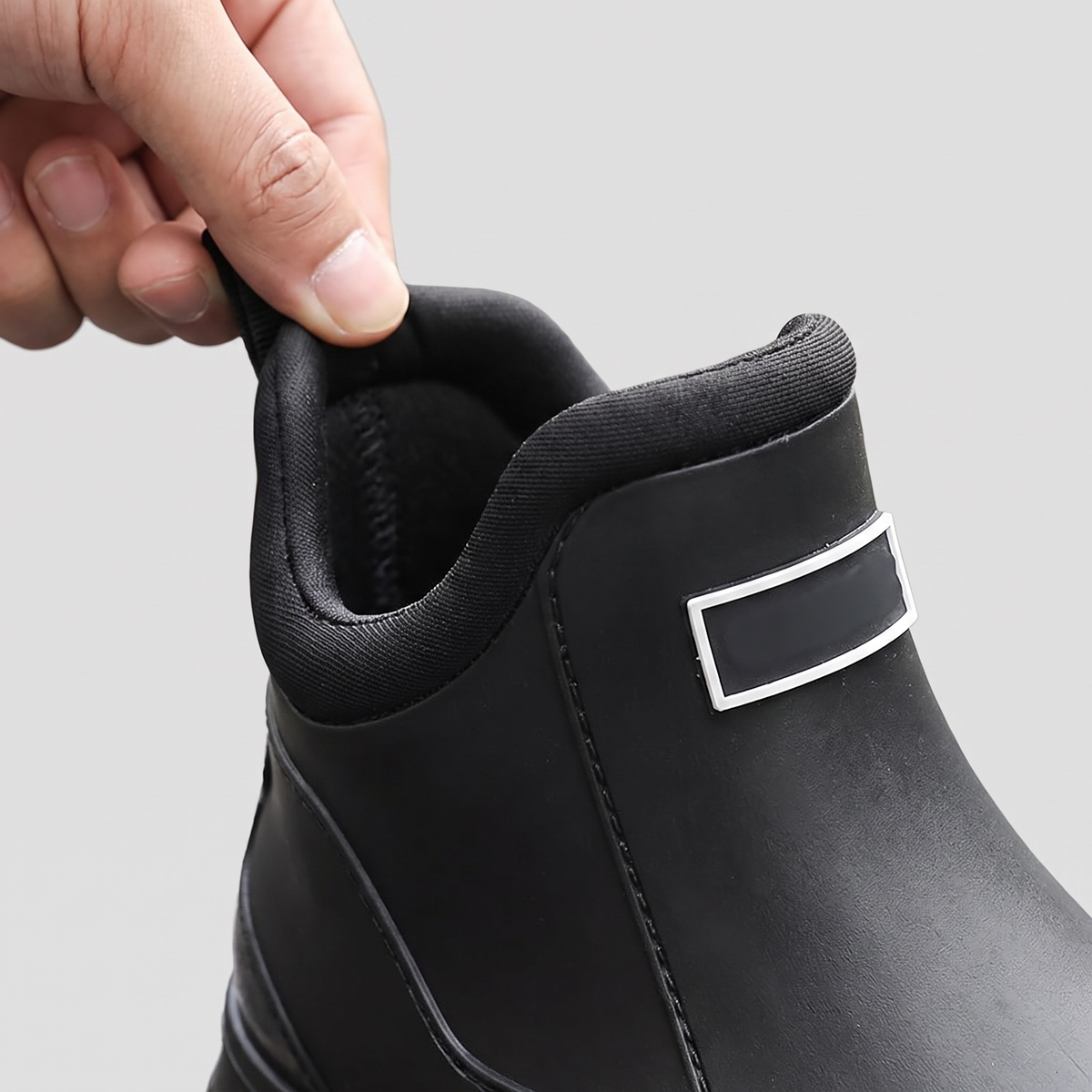 Close-up of the heel pull tab and the padded ankle collar
