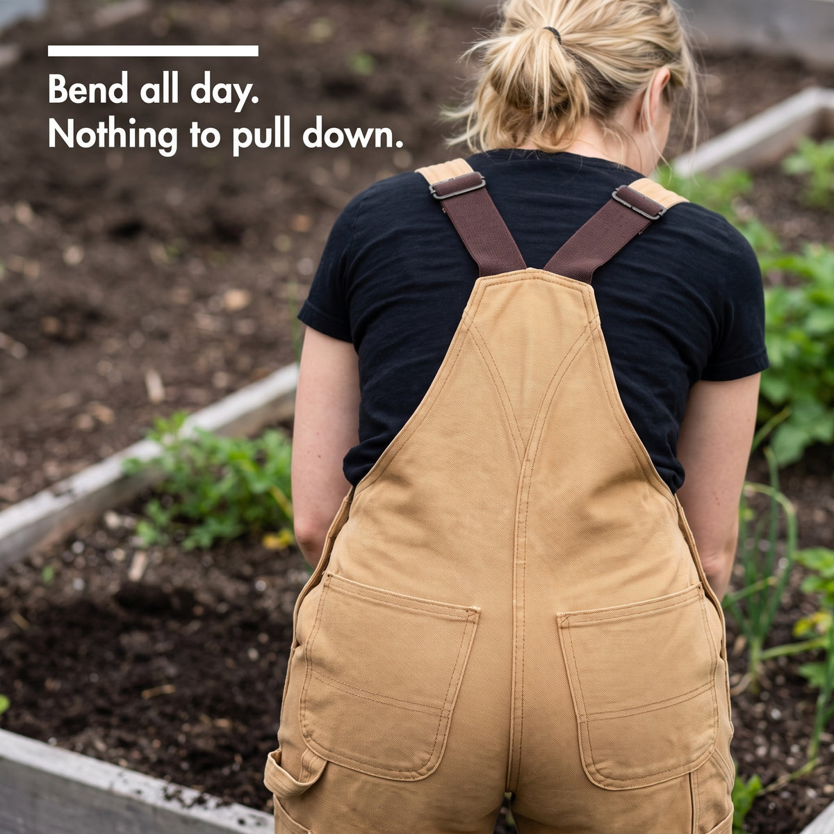 Crossback straps and bib back panel covering the lower back while bent over a garden bed
