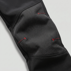 Close-up of the reinforced articulated knee panel and zipped thigh pocket