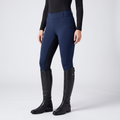 Women's two-tone jodhpurs in navy, pull-on with a wide waistband and a dark inner-leg panel, worn with tall riding boots