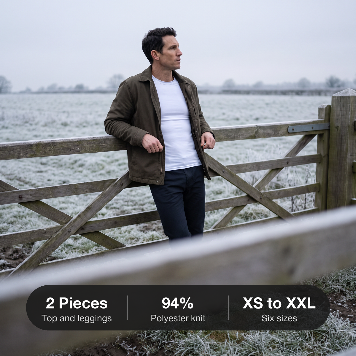 Man at a farm gate in winter wearing the white base layer top under a work jacket: 2 pieces, 94% polyester, XS to XXL