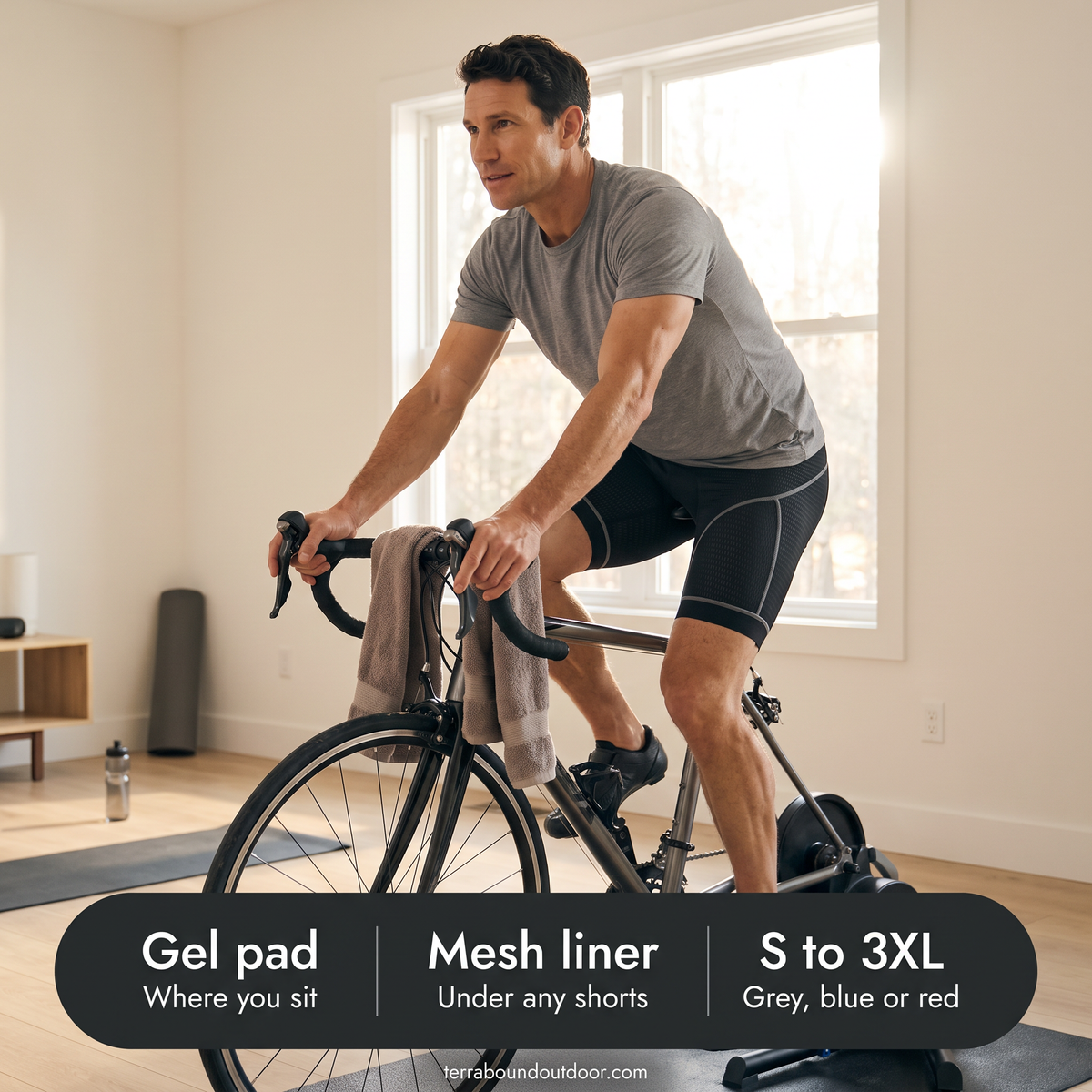 Man riding an indoor trainer at home in the padded cycling liner shorts, with key facts: gel pad, mesh liner, S to 3XL
