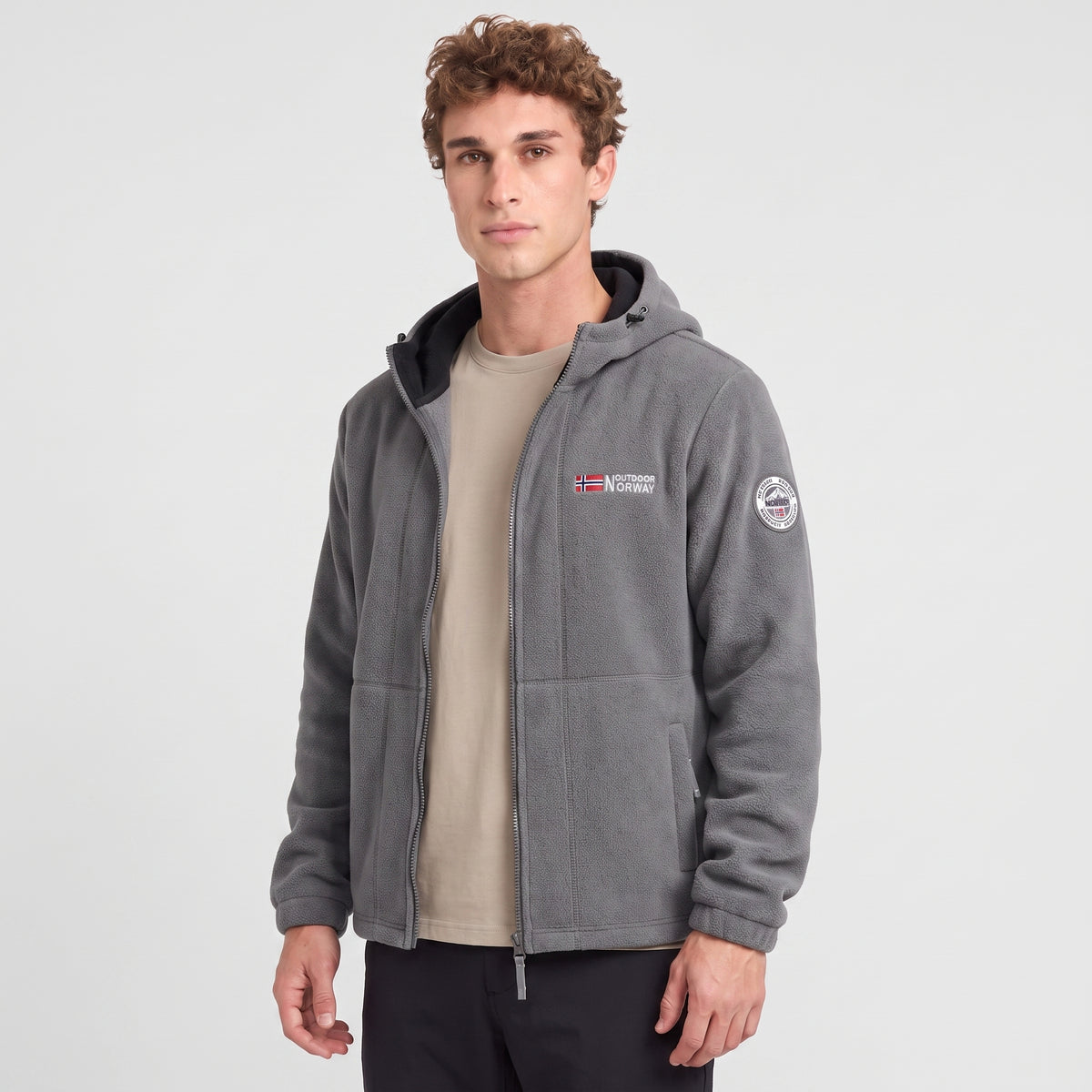 Men's grey windproof fleece jacket worn, three-quarter view