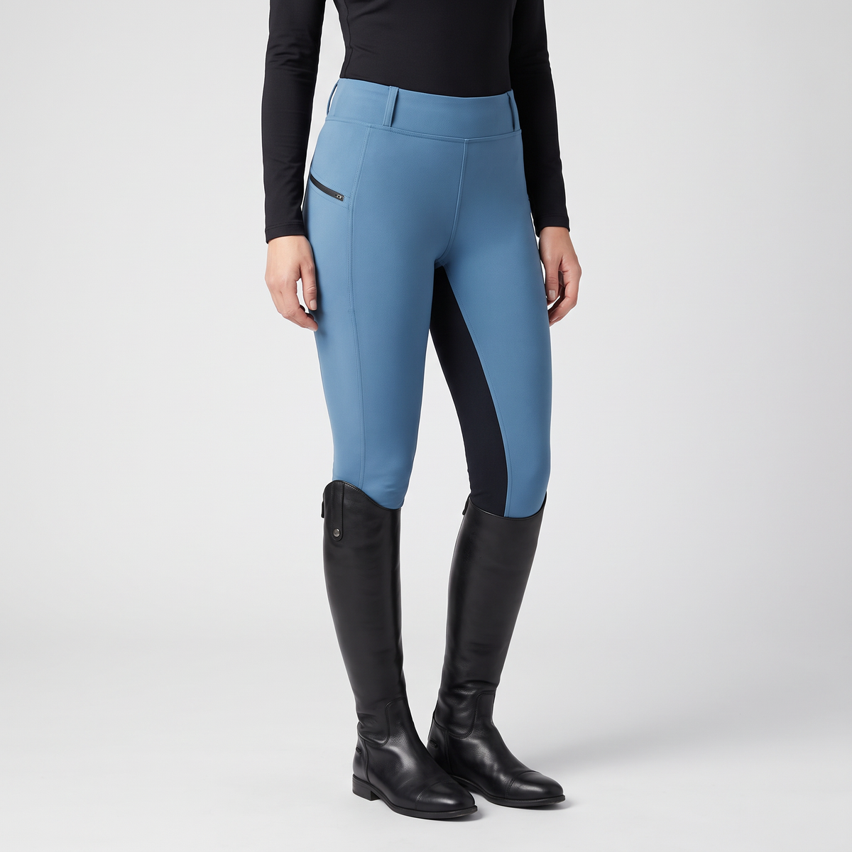Women's two-tone jodhpurs in sky blue with a dark inner-leg panel, front view