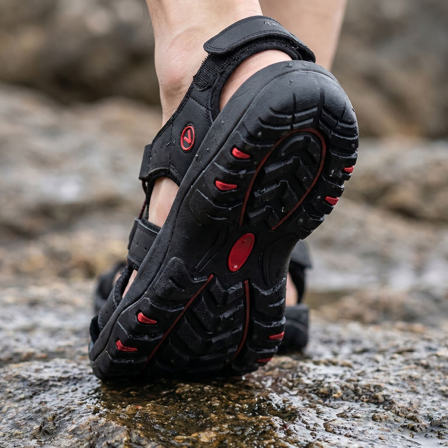 Rubber outsole of the Terrabound Hiking Sandals gripping wet rock