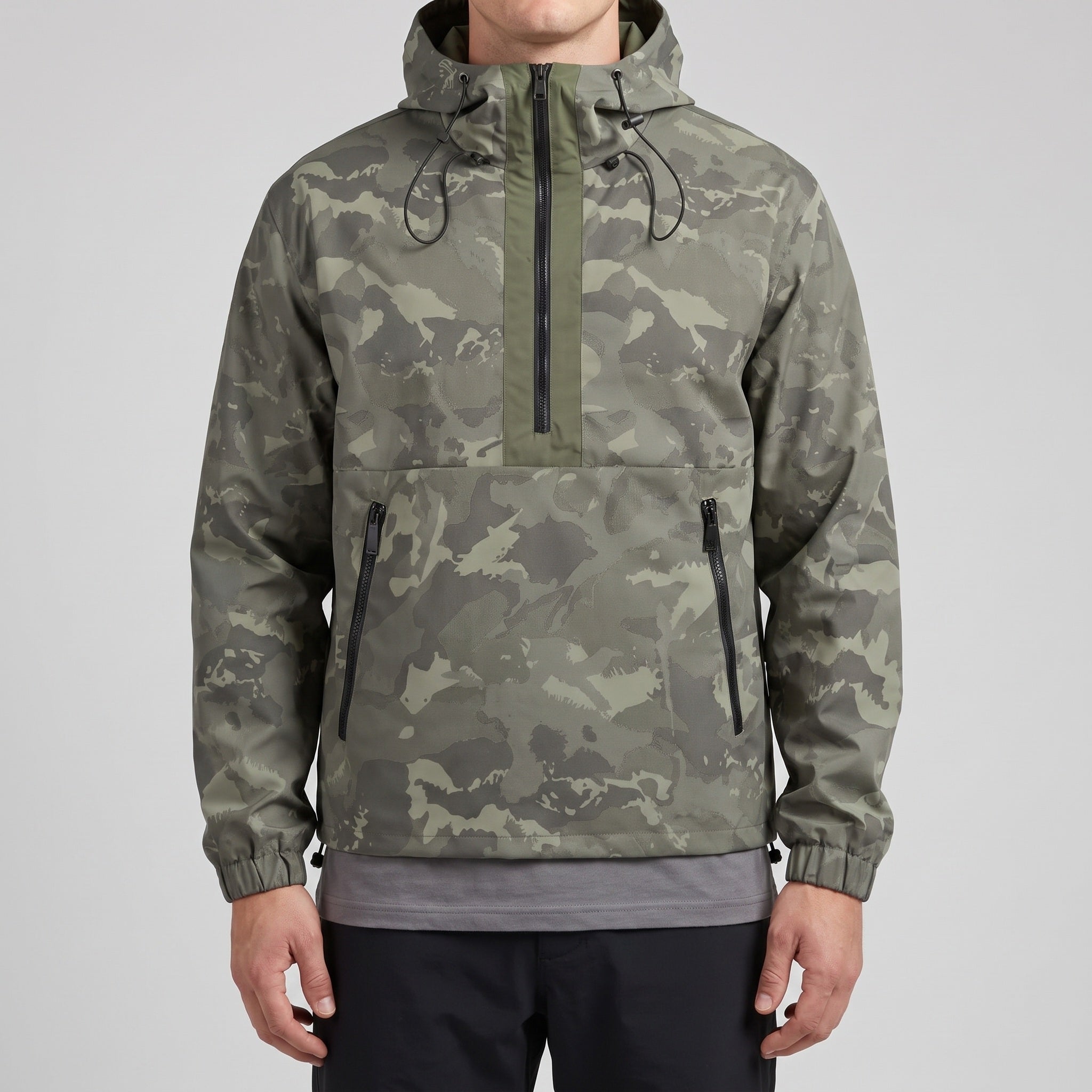 Camo half-zip anorak worn, front view showing the zipped hand pockets
