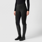 Women's two-tone jodhpurs in black, front view with tall riding boots