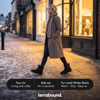 Woman walking down a frosty high street at dusk in black winter boots