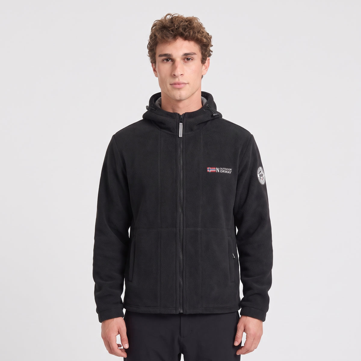 Men's black windproof fleece jacket worn zipped up, front view