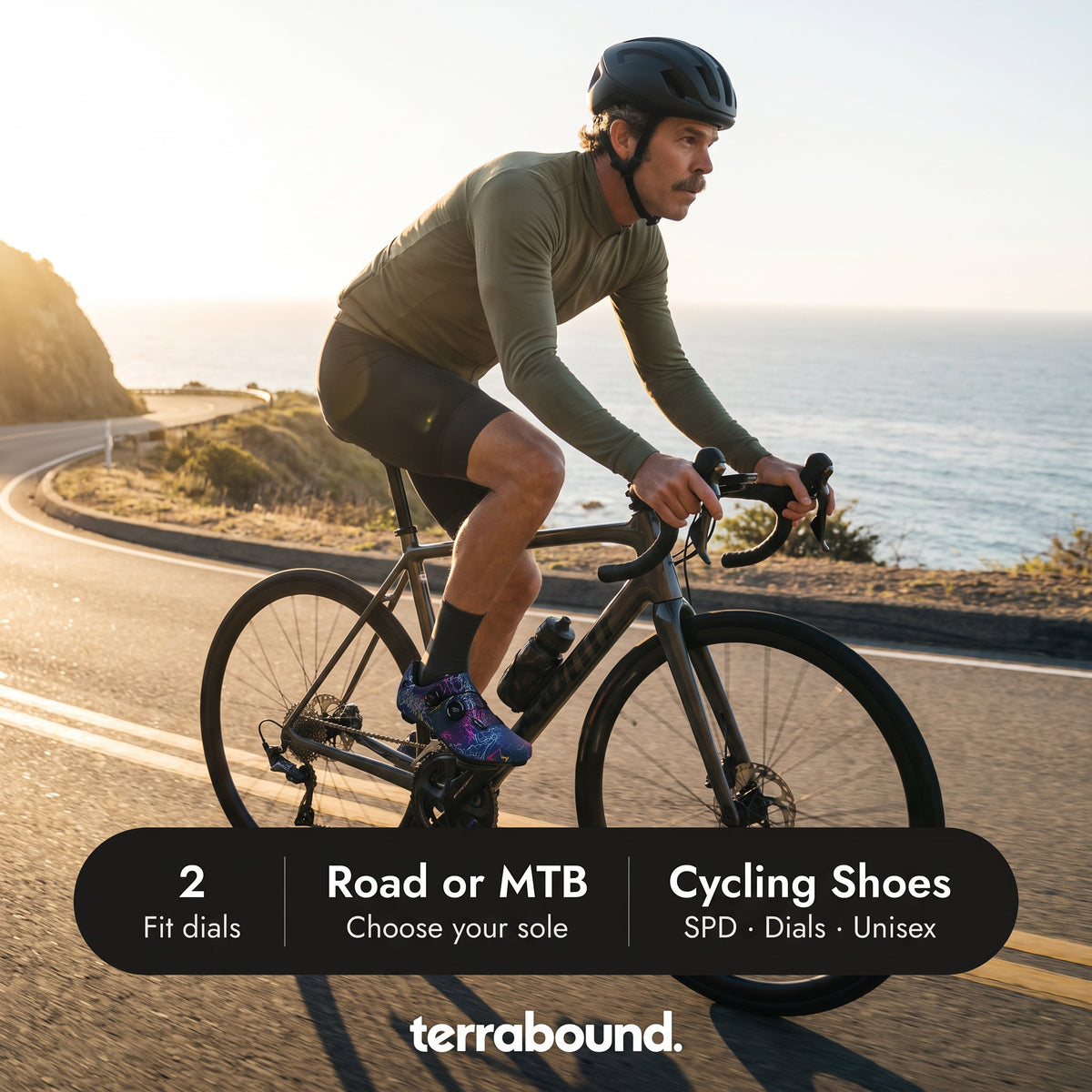 Cyclist on a coast road in Dark Blue cycling shoes with two fit dials and a road or MTB sole