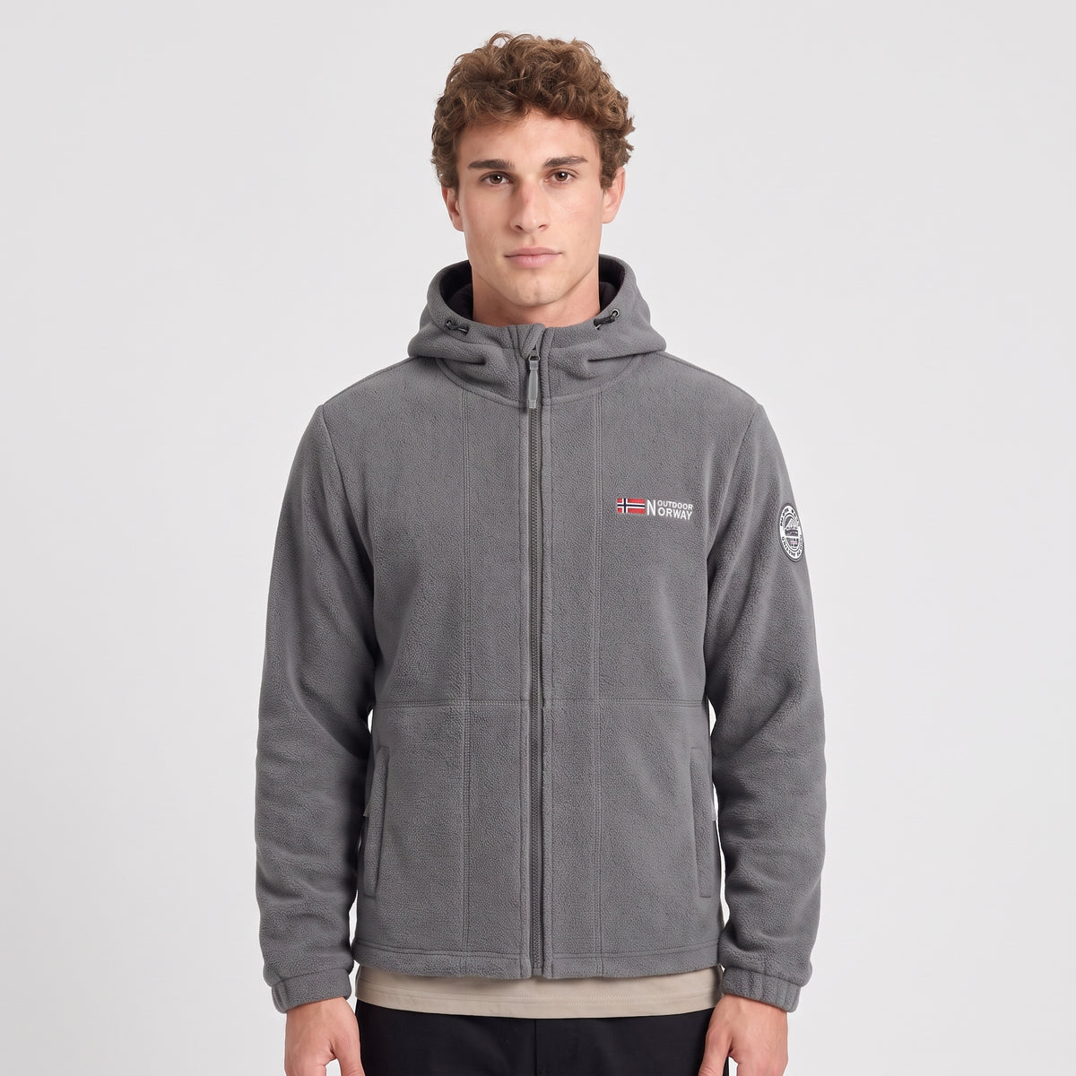 Men's grey windproof fleece jacket worn zipped up, front view