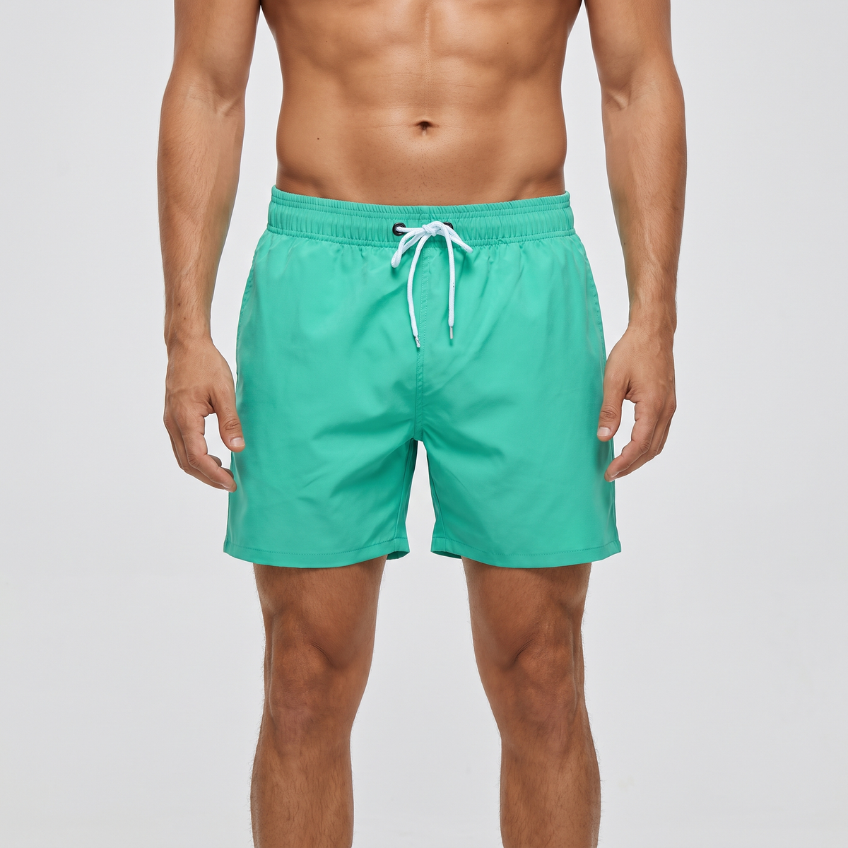 Men's swim shorts in mint with white drawcord, front view