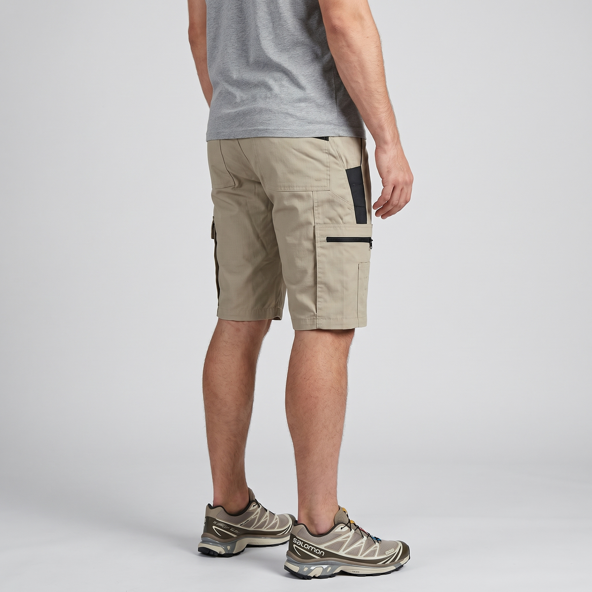 Three-quarter side view of the Khaki cargo shorts showing the zipped thigh pocket