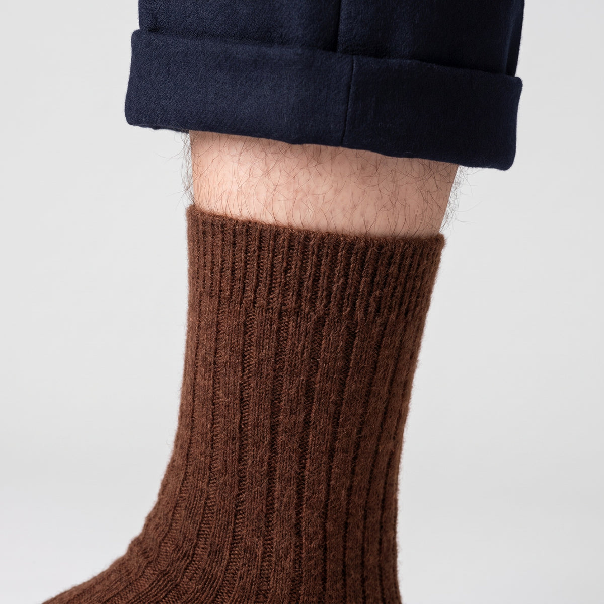 Ribbed cuff sitting on the calf
