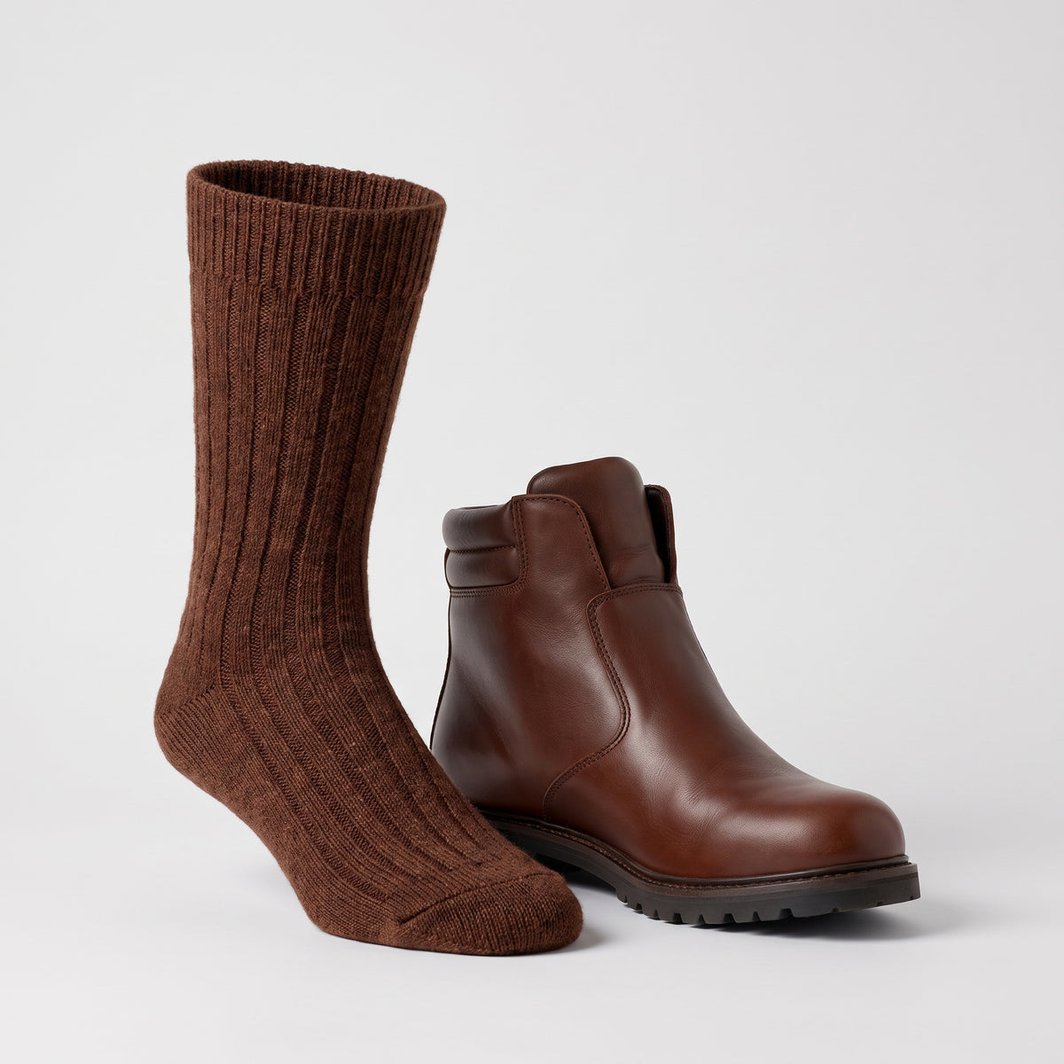 Sock height compared with a leather boot