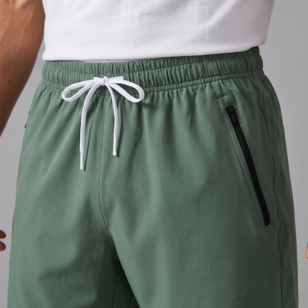 Drawcord waistband and zip pocket close-up
