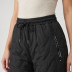 Women's fleece lined quilted trousers: drawcord waist and zipped hip pocket close-up