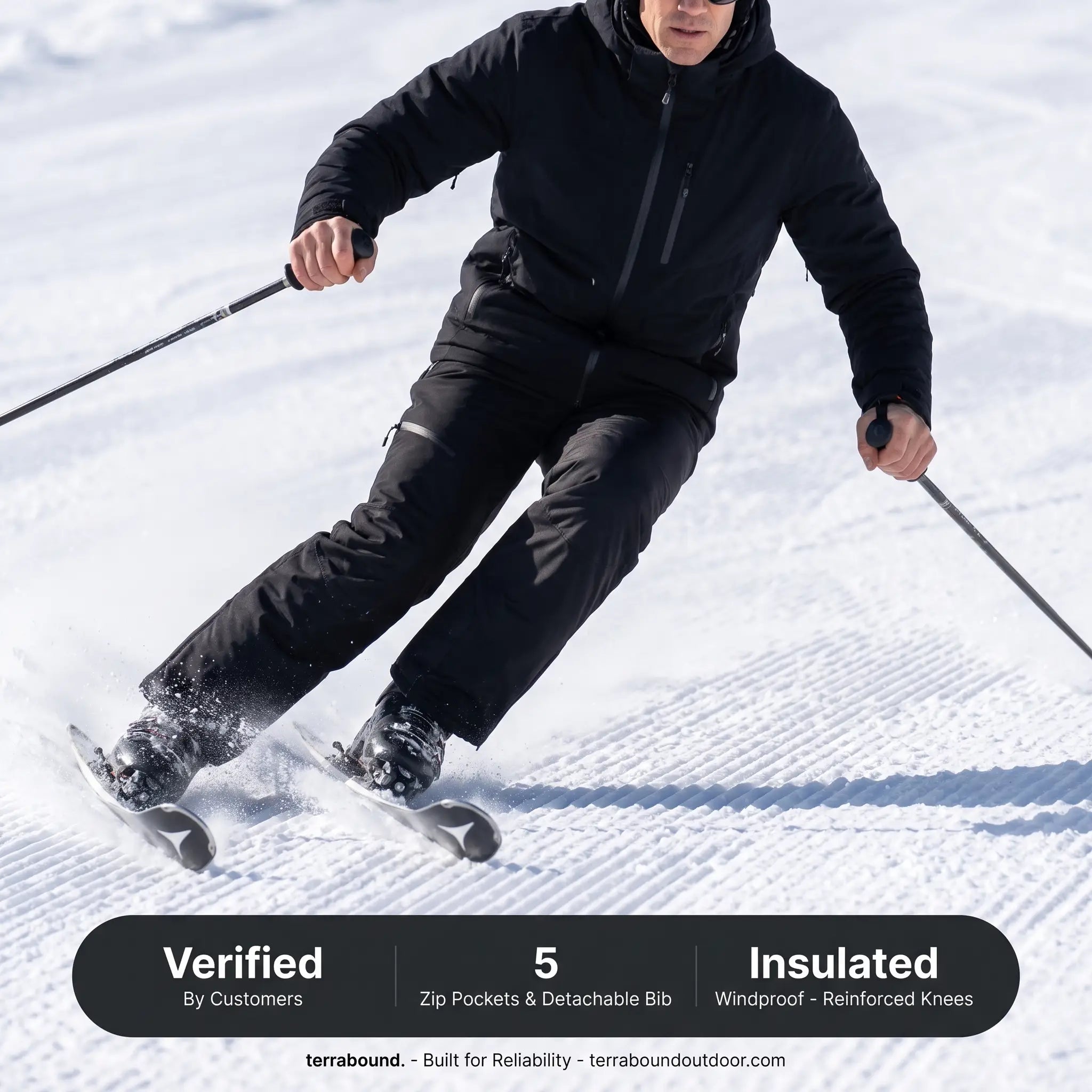 Skier in action wearing terrabound. ski trousers under a fully zipped ski jacket
