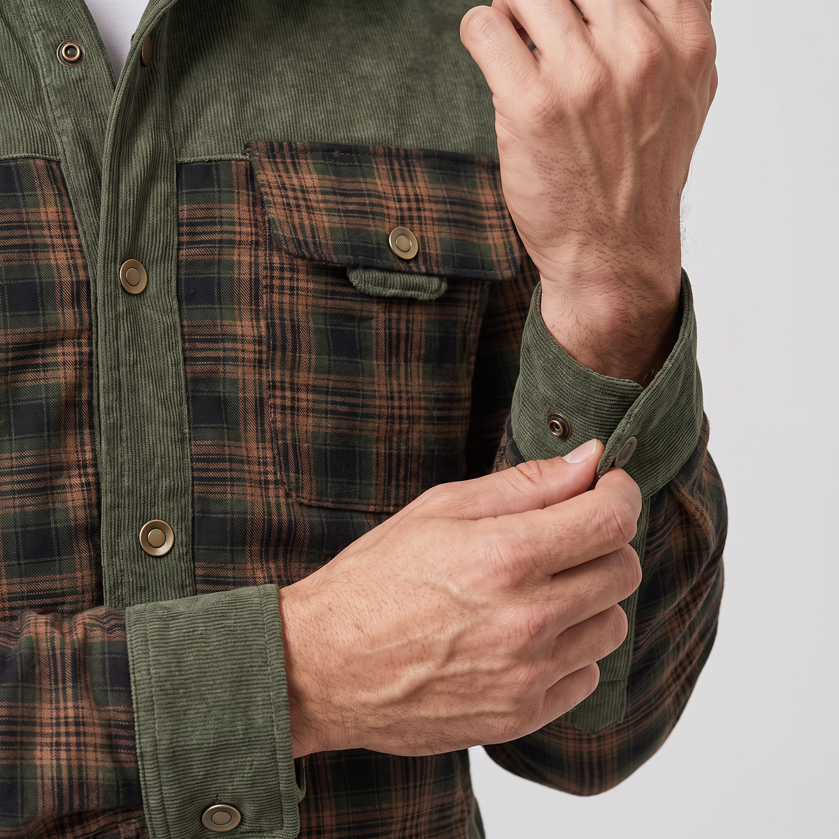 Close-up of the snap-flap chest pocket, snap placket and corduroy snap cuff