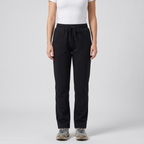 Woman wearing the black fleece lined straight leg joggers, front view from chest to shoes