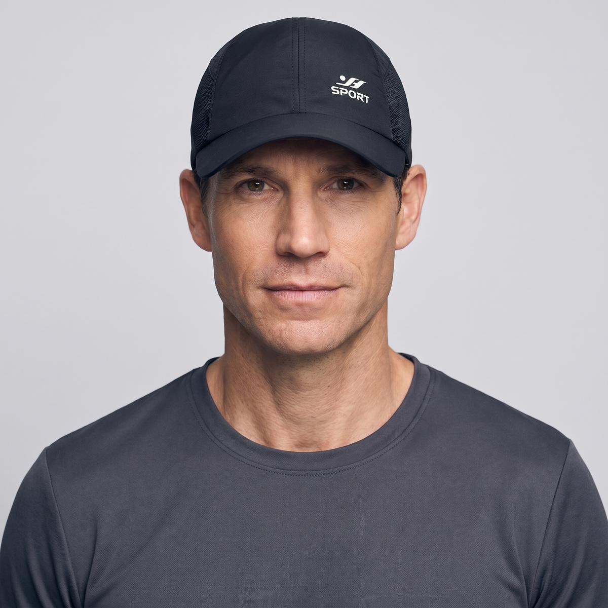Man wearing the black running cap, studio front view