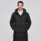 Man wearing the men's long puffer coat in Black, studio front view