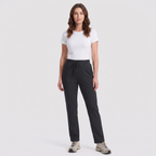 Woman wearing the black fleece lined joggers with a white t-shirt and trail shoes, full length