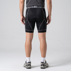 Back view of the grey padded cycling liner shorts worn, showing the seat pad shape and back seams