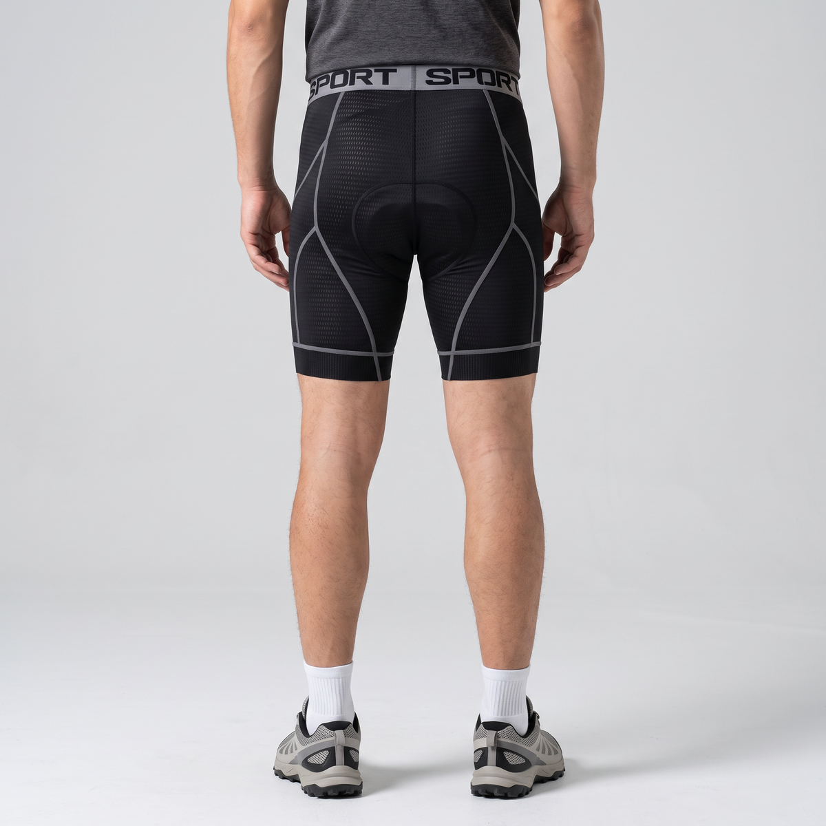 Back view of the grey padded cycling liner shorts worn, showing the seat pad shape and back seams