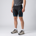 Three-quarter side view of the blue padded cycling liner shorts worn
